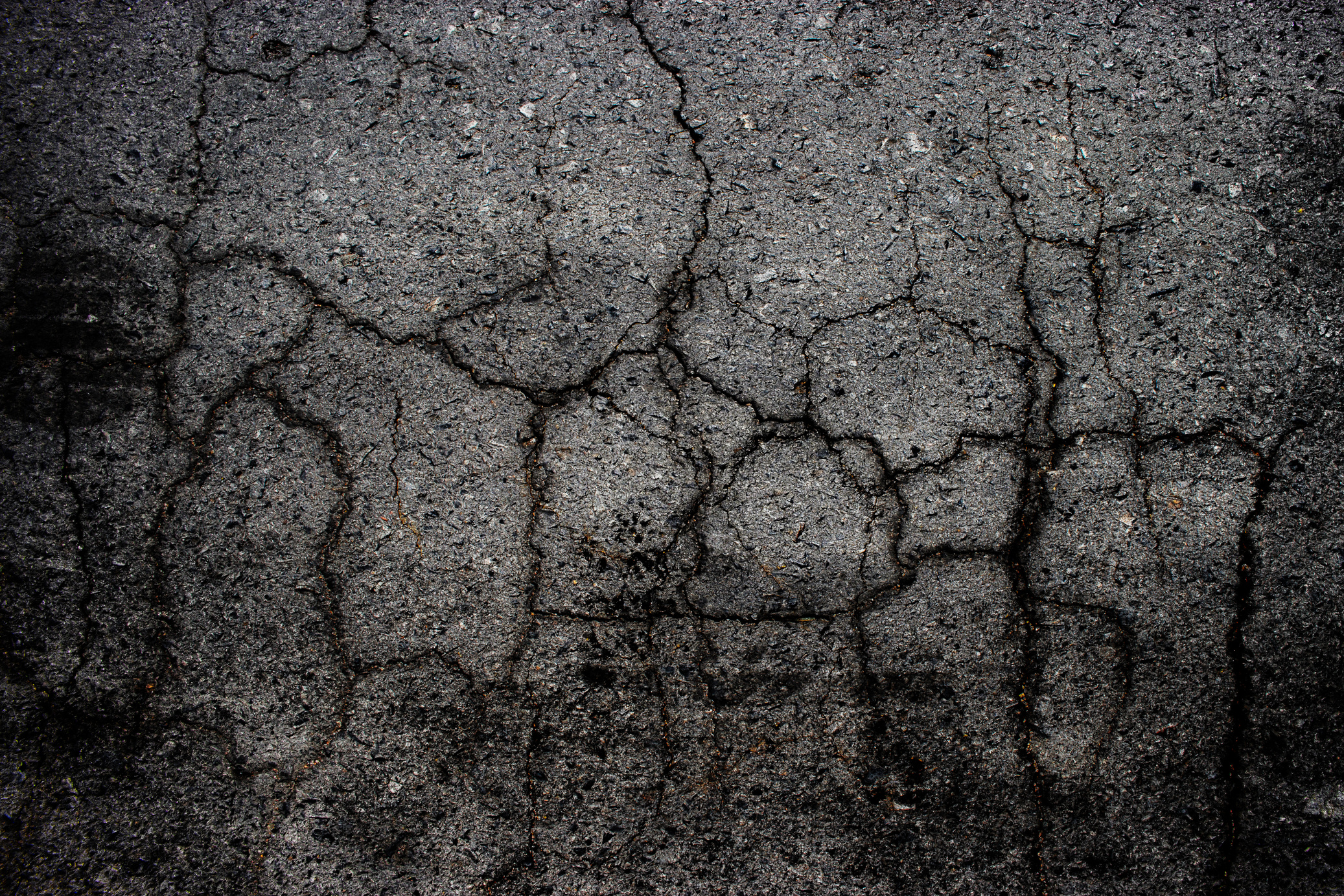 Cracked asphalt floor.